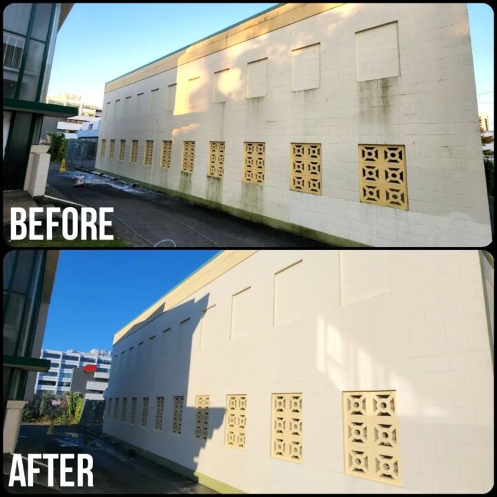 Before/after pressure washing the side of a building.